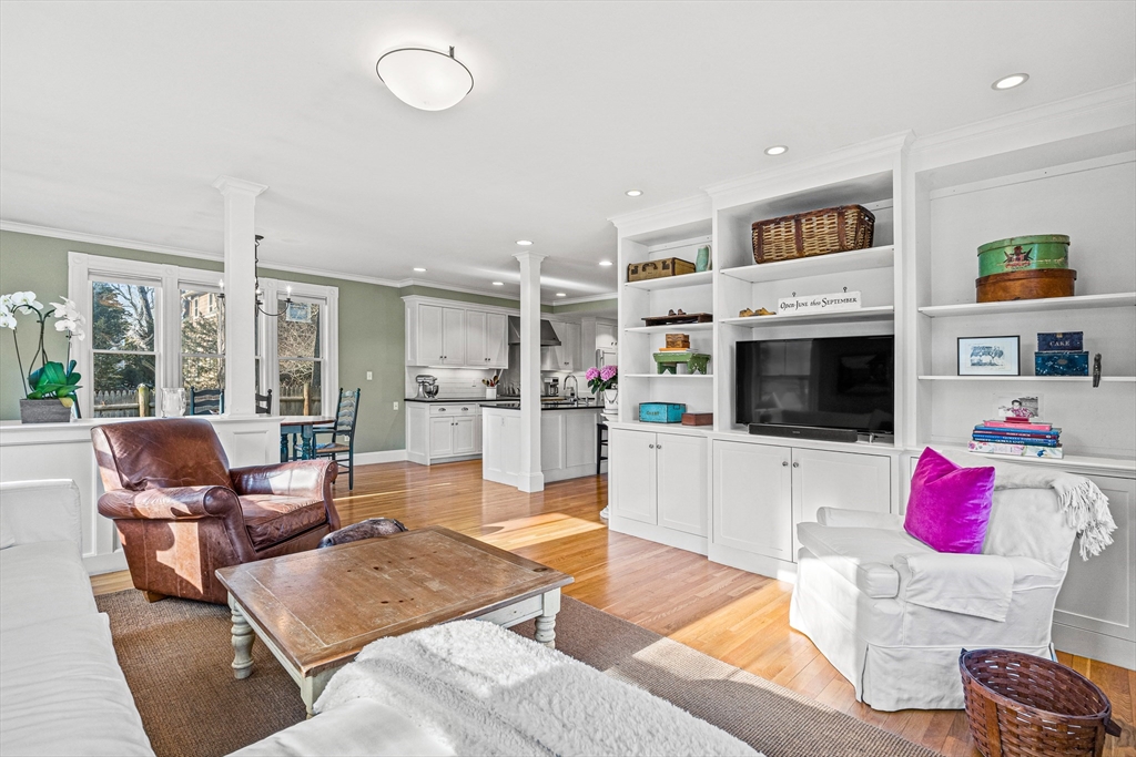 7 Water Street Natick, MA 01760 - Photo 8 of 26 a living room with furniture flat screen tv and a fireplace