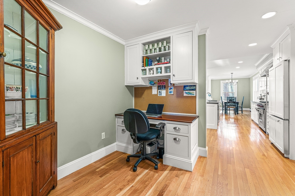 7 Water Street Natick, MA 01760 - Photo 9 of 26 a view of a workspace with furniture and wooden floor