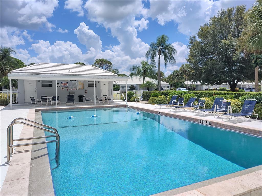 276 Cerromar Way South, Unit 60 Venice, FL 34293 - Photo 2 of 31 a view of a swimming pool with outdoor seating