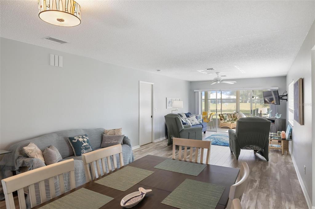 276 Cerromar Way South, Unit 60 Venice, FL 34293 - Photo 10 of 31 a living room with furniture and wooden floor