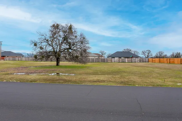 a view of a lake with houses in the back