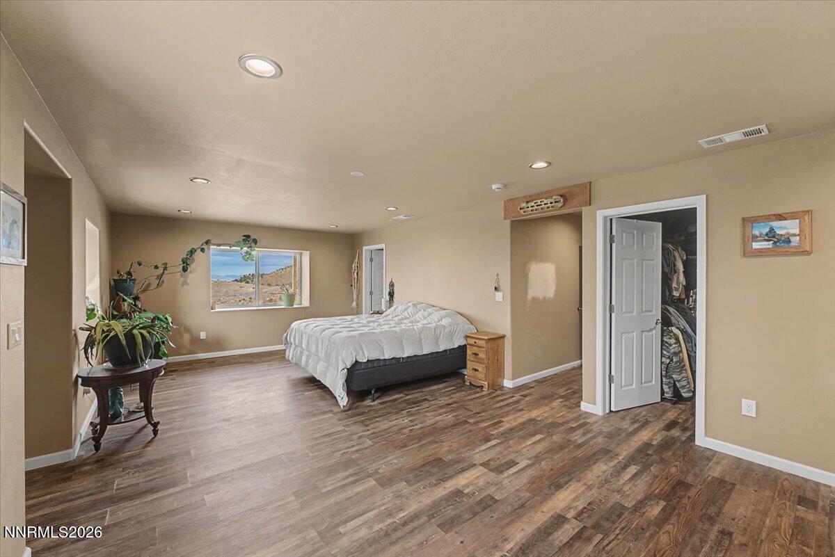 2300 Temple Hill Road Reno, NV 89521 - Photo 11 of 63 a spacious bedroom with a bed and a table in it