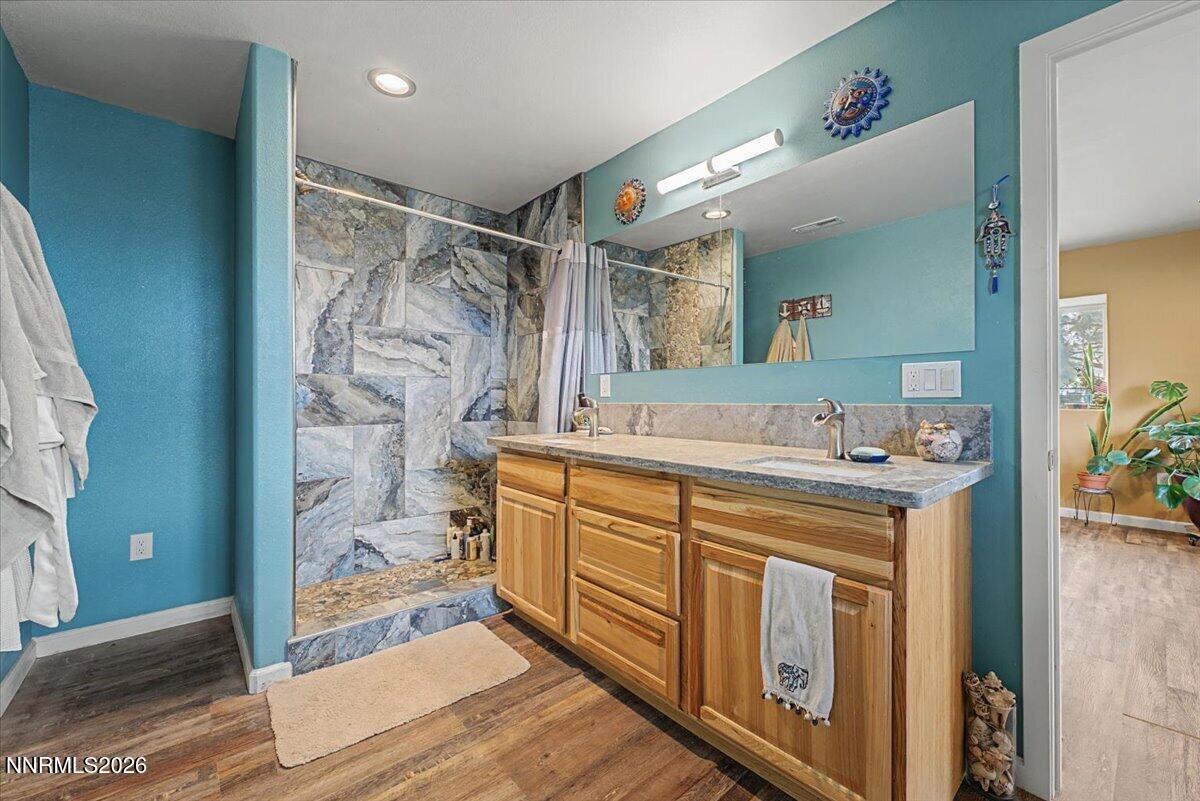 2300 Temple Hill Road Reno, NV 89521 - Photo 17 of 63 a bathroom with a double vanity sink mirror and shower