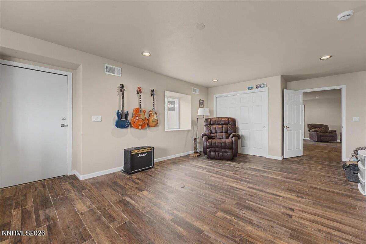 2300 Temple Hill Road Reno, NV 89521 - Photo 29 of 63 a view of a room with wooden floor and a ceiling fan