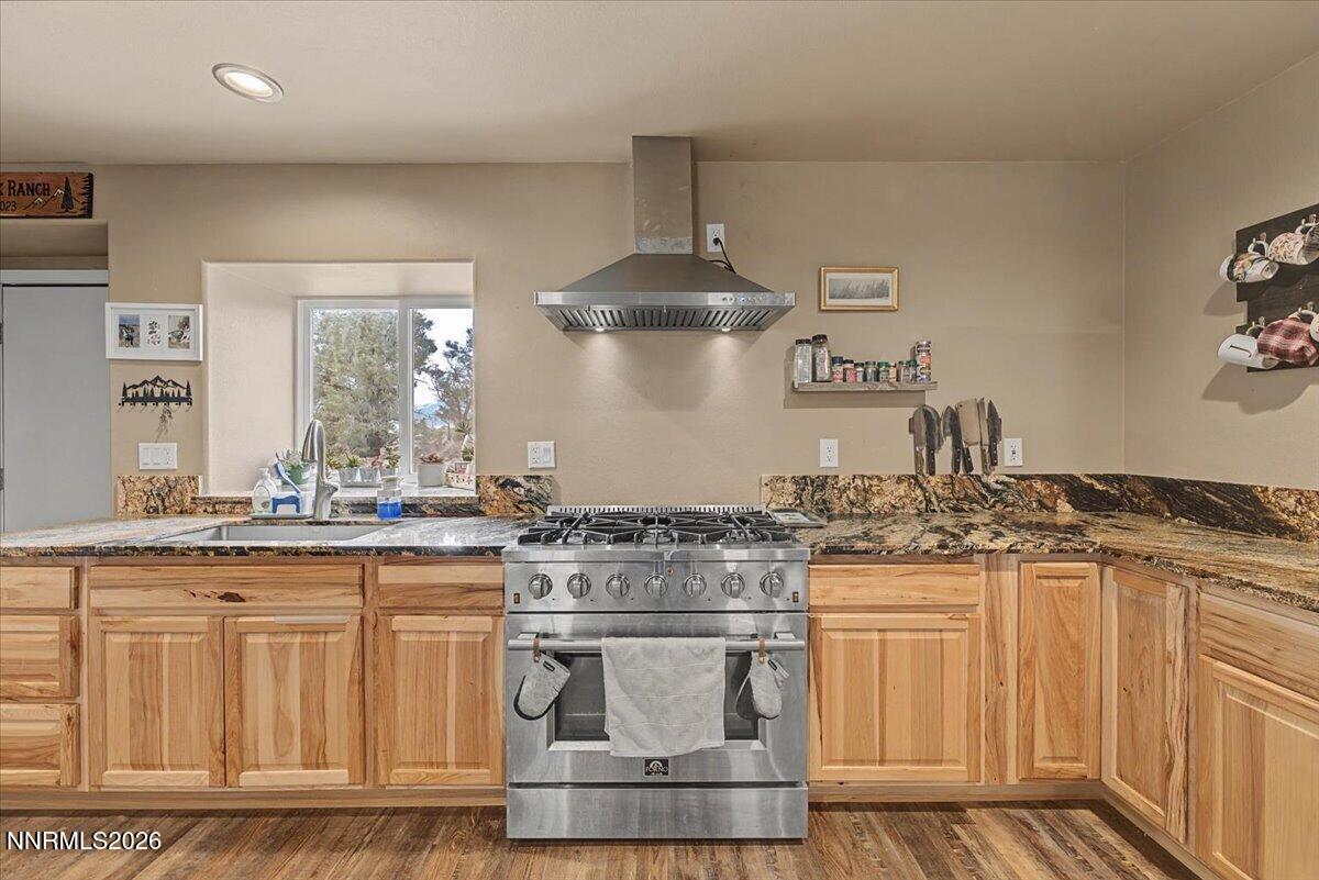 2300 Temple Hill Road Reno, NV 89521 - Photo 5 of 63 a kitchen with stainless steel appliances granite countertop a stove and cabinets