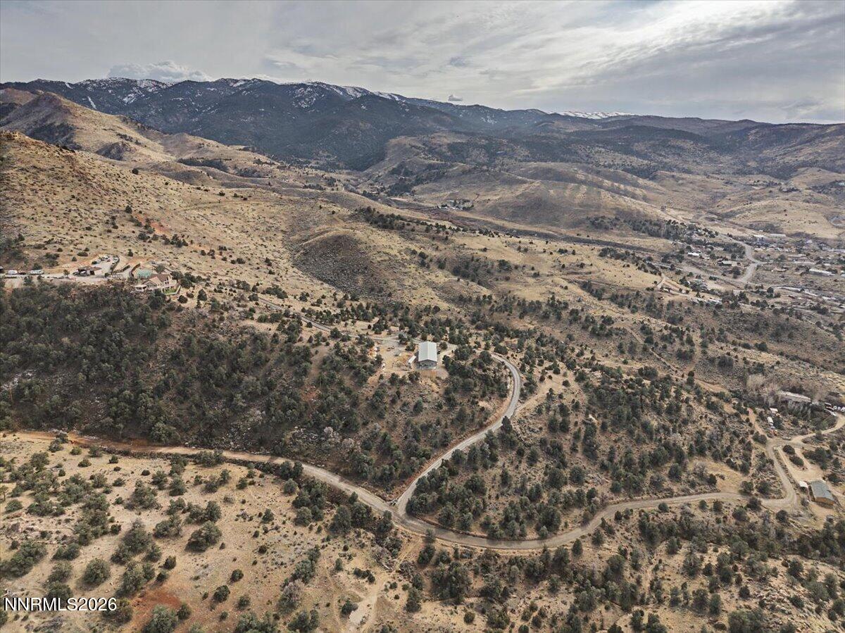 2300 Temple Hill Road Reno, NV 89521 - Photo 62 of 63 a view of a dry yard with mountains in the background