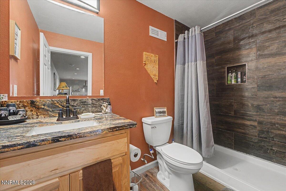 2300 Temple Hill Road Reno, NV 89521 - Photo 9 of 63 a bathroom with a granite countertop sink toilet and shower