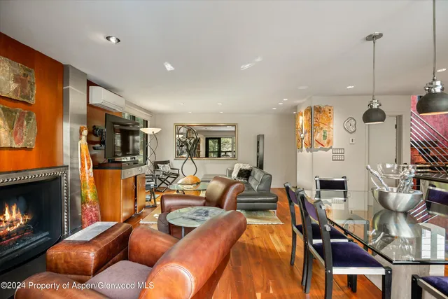 a living room with furniture fireplace and a flat screen tv