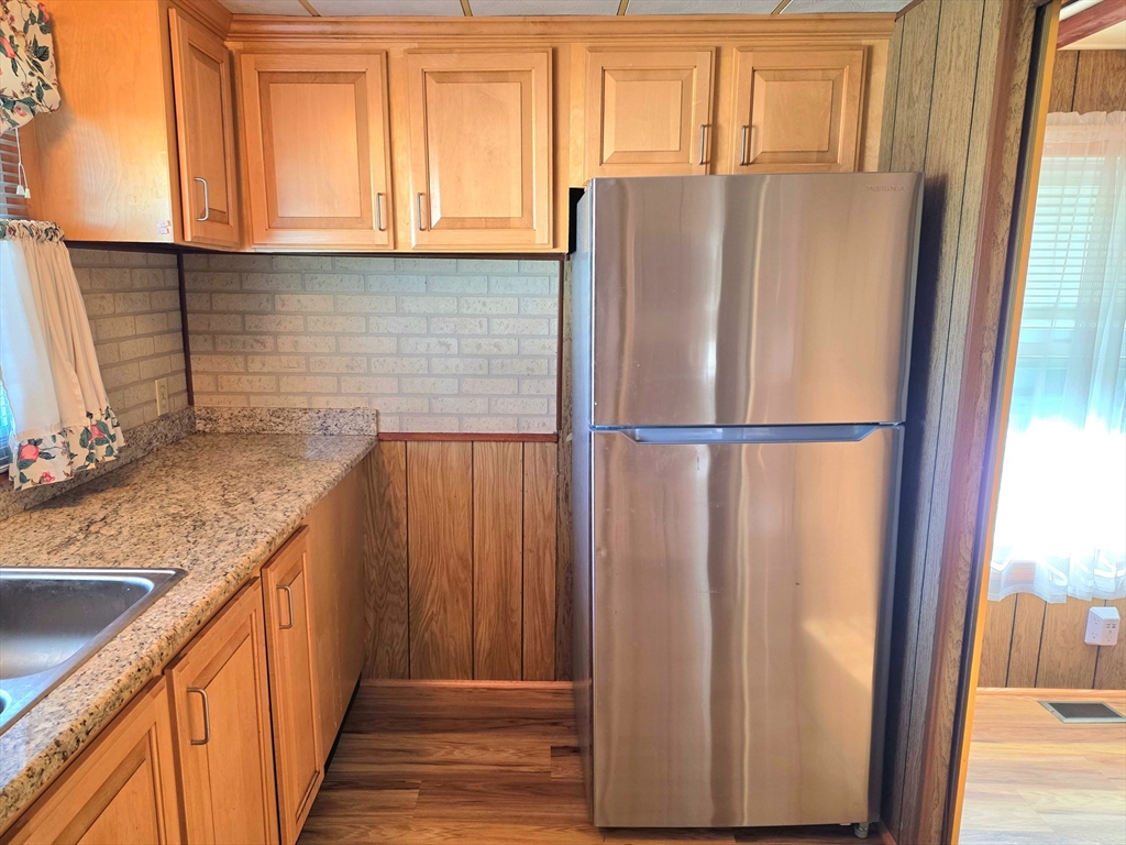 1760 Westover Road, Unit 2 Chicopee, MA 01020 - Photo 13 of 20 a kitchen with stainless steel appliances granite countertop a refrigerator and a sink