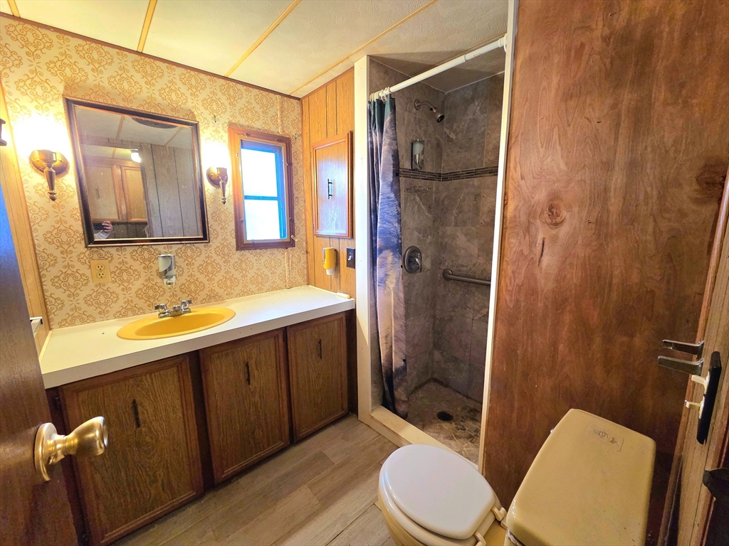 1760 Westover Road, Unit 2 Chicopee, MA 01020 - Photo 17 of 20 a bathroom with a sink a toilet and shower