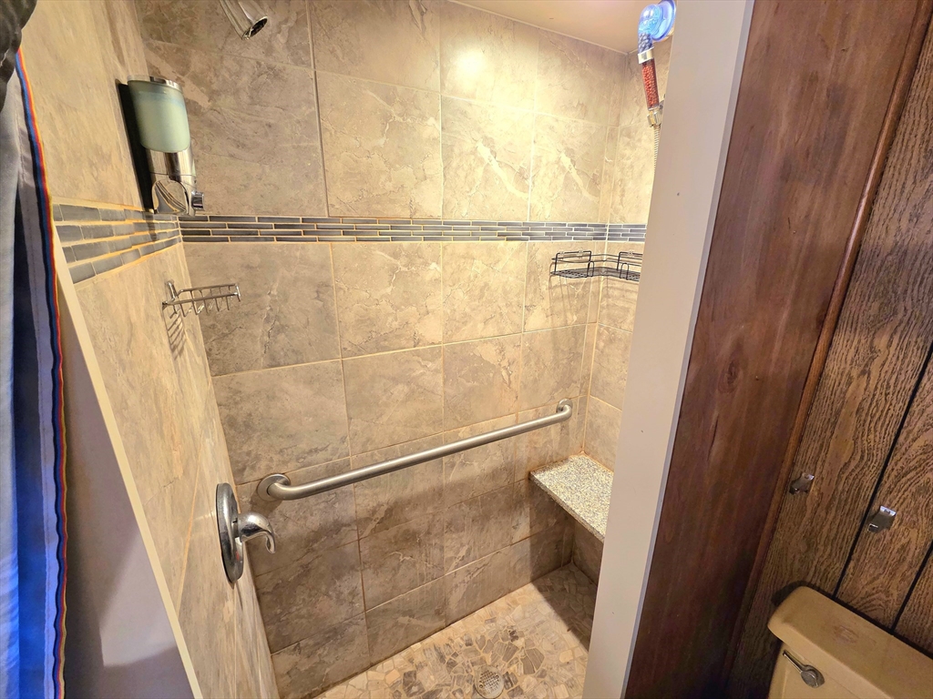 1760 Westover Road, Unit 2 Chicopee, MA 01020 - Photo 18 of 20 a bathroom with a glass shower door