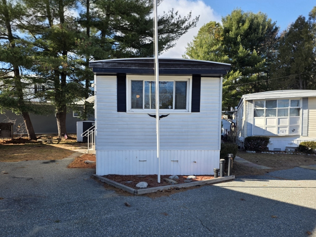 1760 Westover Road, Unit 2 Chicopee, MA 01020 - Photo 2 of 20 a front view of a house with a yard