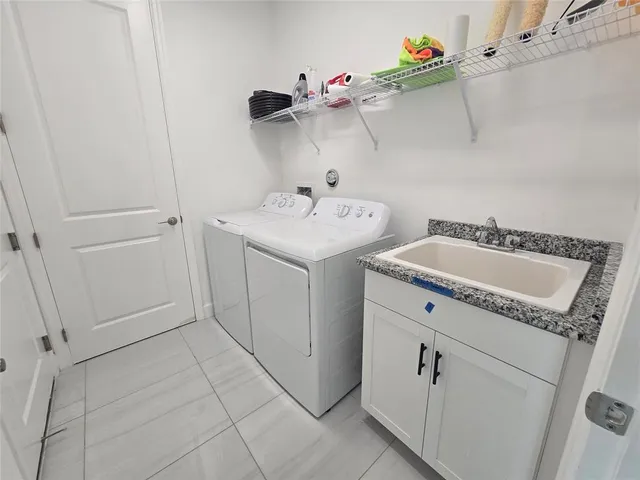a utility room with dryer and washer