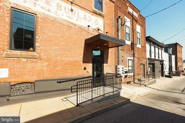 a view of a brick building with a street view