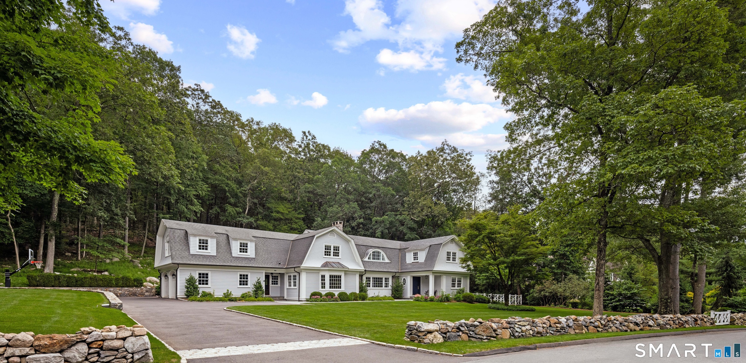99 Hickok Road New Canaan, CT 06840 - Photo 32 of 39 a front view of a house with garden