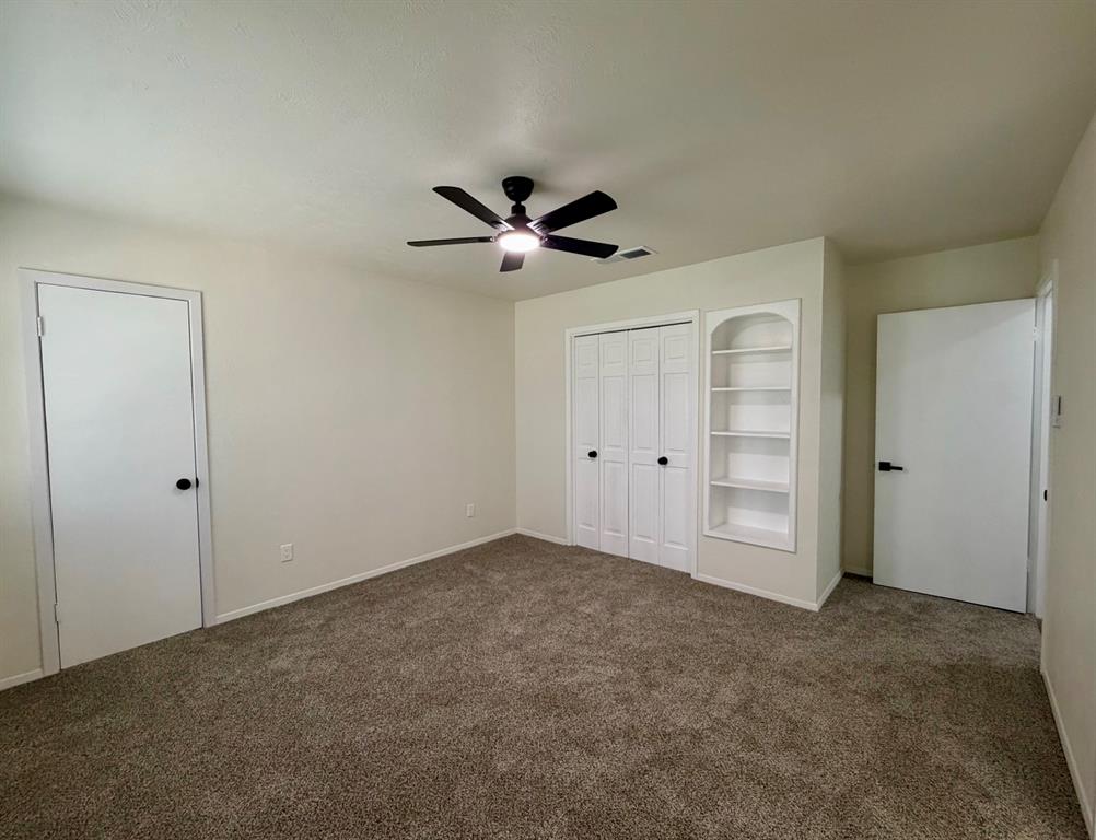 3609 Country Club Road Arlington, TX 76013 - Photo 35 of 40 an empty room with closet and windows
