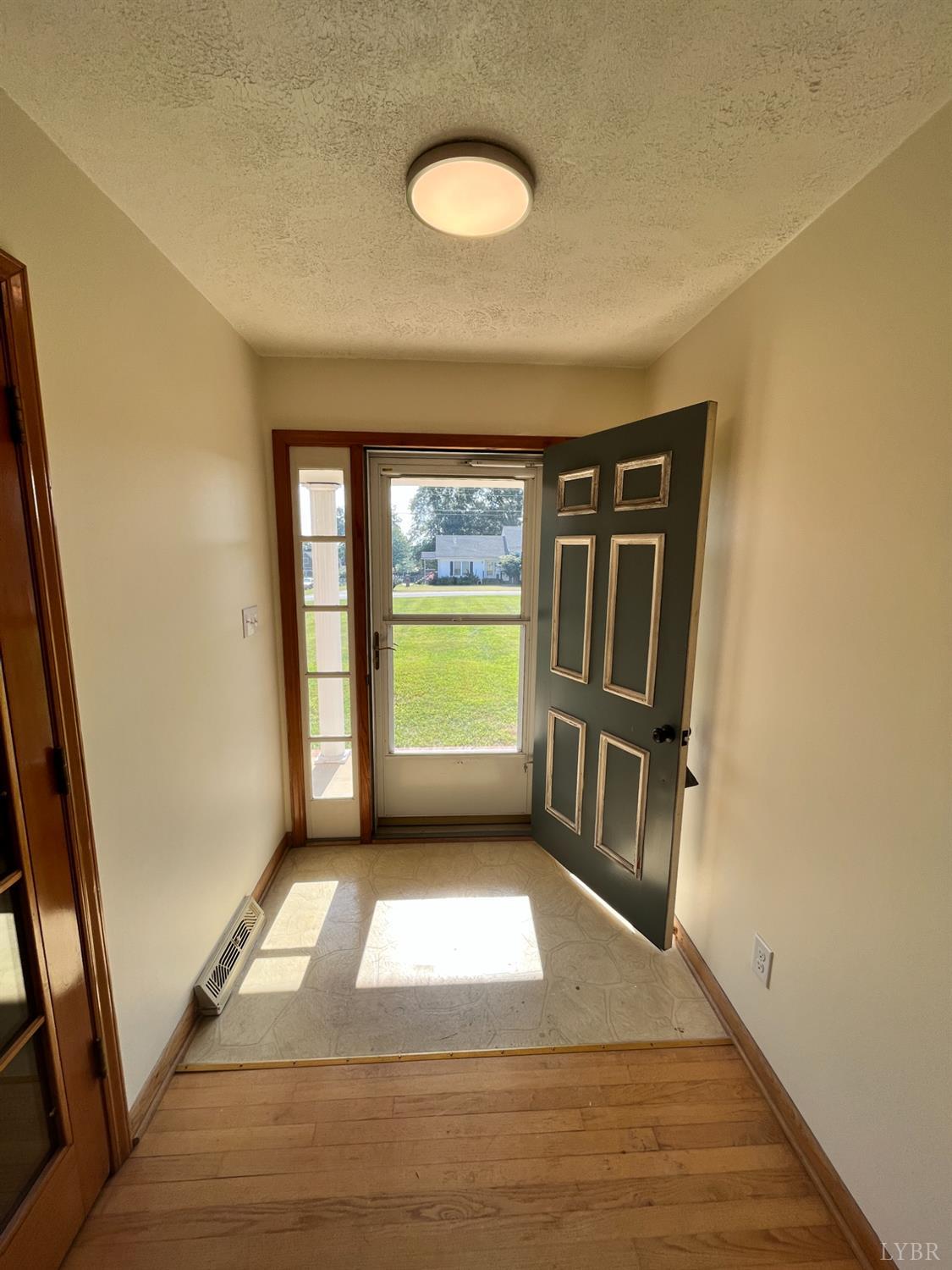 73 High View Place Lynchburg, VA 24502 - Photo 19 of 25 a view of an empty room with a fireplace and a window
