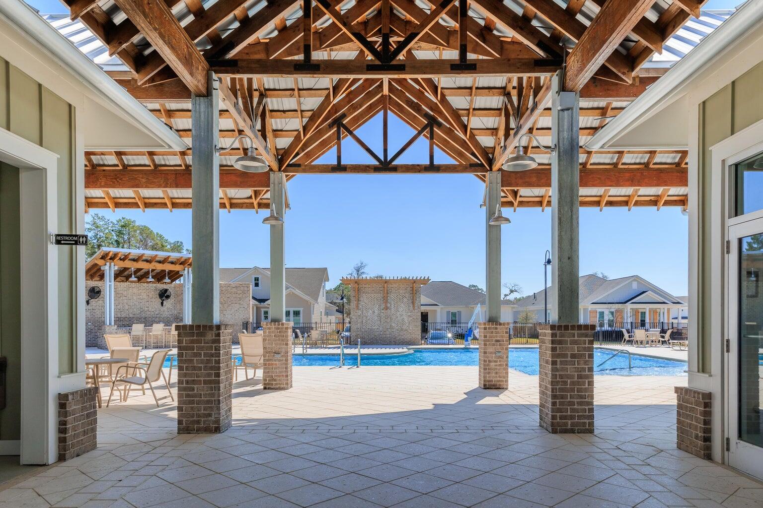 723 Reindeer Road Niceville, FL 32578 - Photo 3 of 8 a building outdoor space with patio and glass windows
