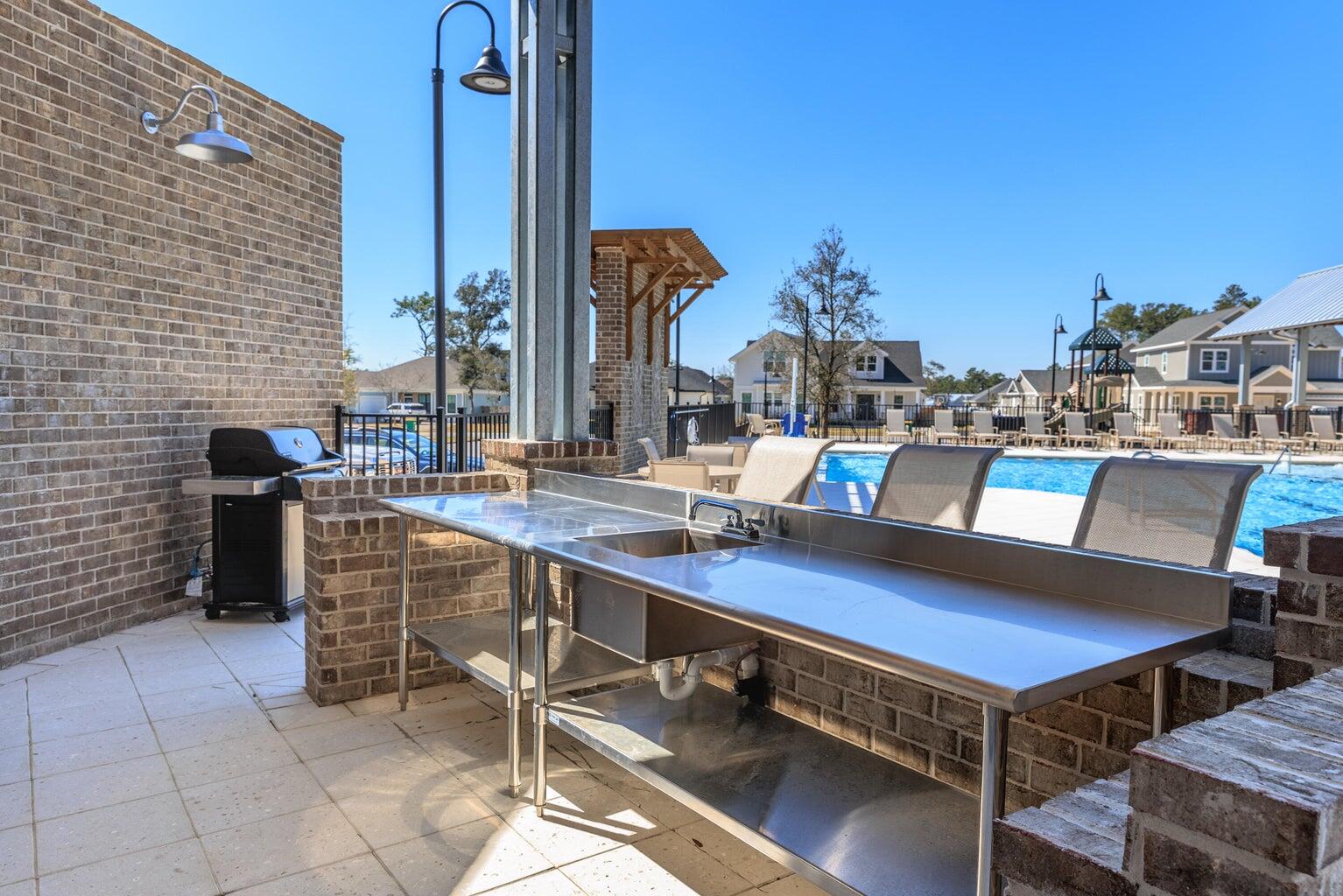 723 Reindeer Road Niceville, FL 32578 - Photo 5 of 8 a outdoor sitting area with a table and chairs