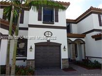 Miami-Dade County Hialeah, FL 33018 - Photo 1 of 1 front view of a house with a small yard