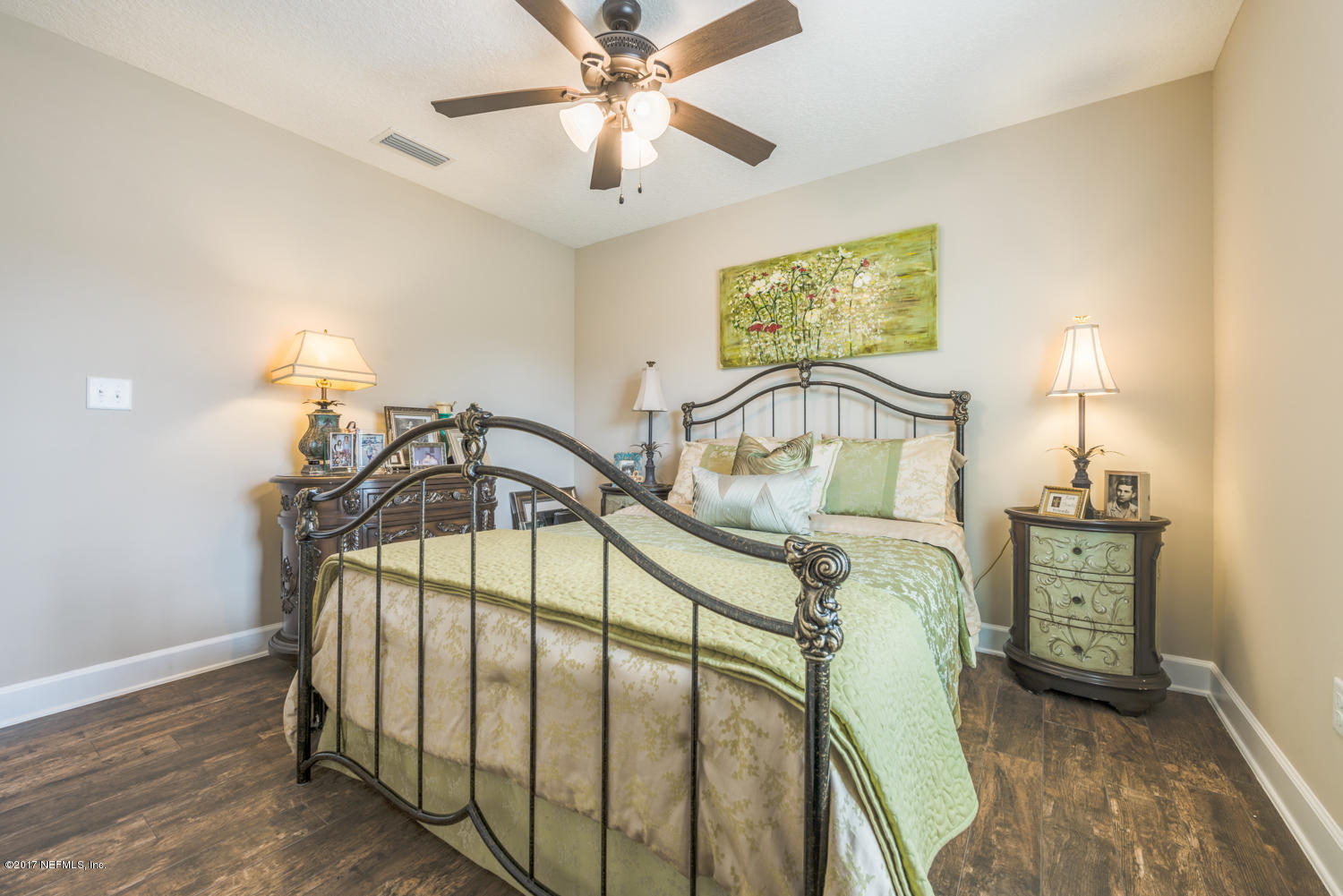 279 Basque Road St. Augustine, FL 32080 - Photo 11 of 29 a bedroom with a bed and a chandelier