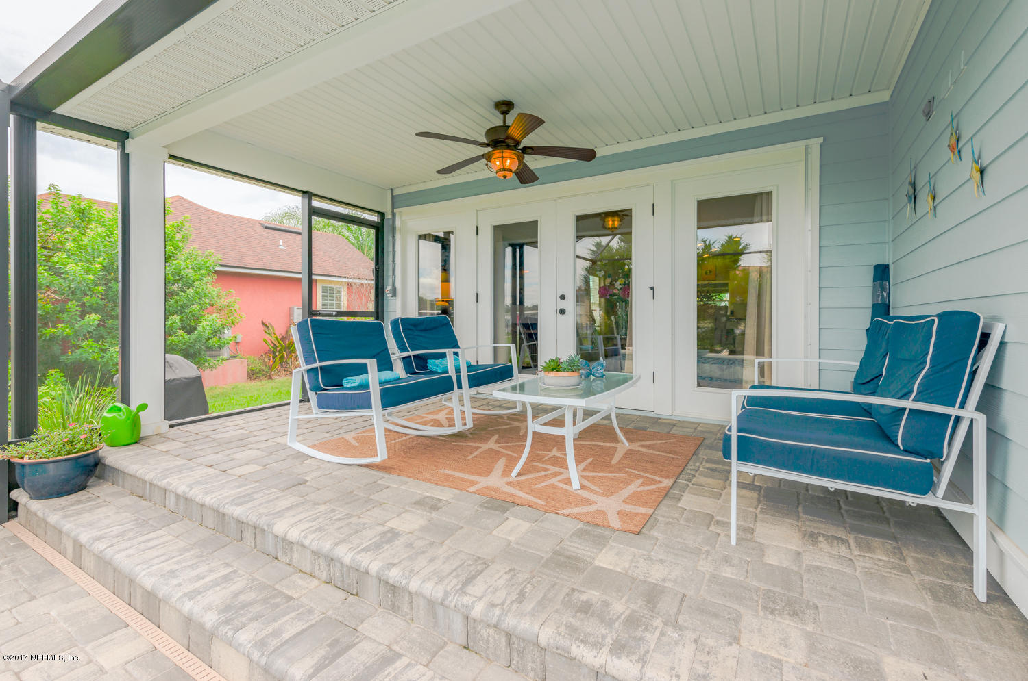 279 Basque Road St. Augustine, FL 32080 - Photo 14 of 29 a view of a patio with a table and chairs