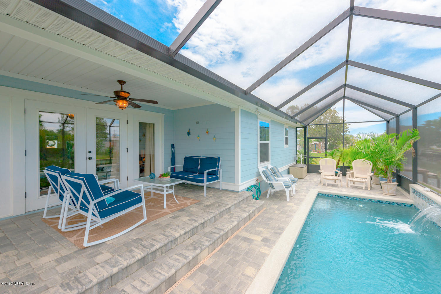 279 Basque Road St. Augustine, FL 32080 - Photo 17 of 29 a view of a patio with a table and chairs and potted plants