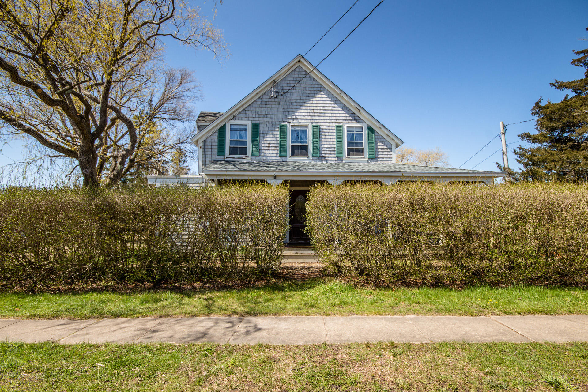 166 Katama Road Edgartown, MA 02539 - Photo 1 of 42 a front view of a house with a yard