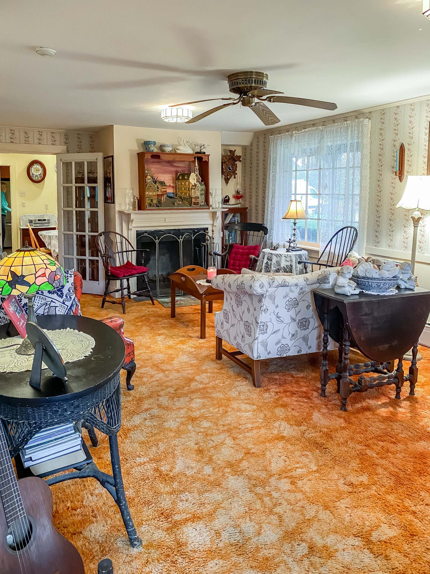 166 Katama Road Edgartown, MA 02539 - Photo 13 of 42 a living room with fireplace furniture and a large window