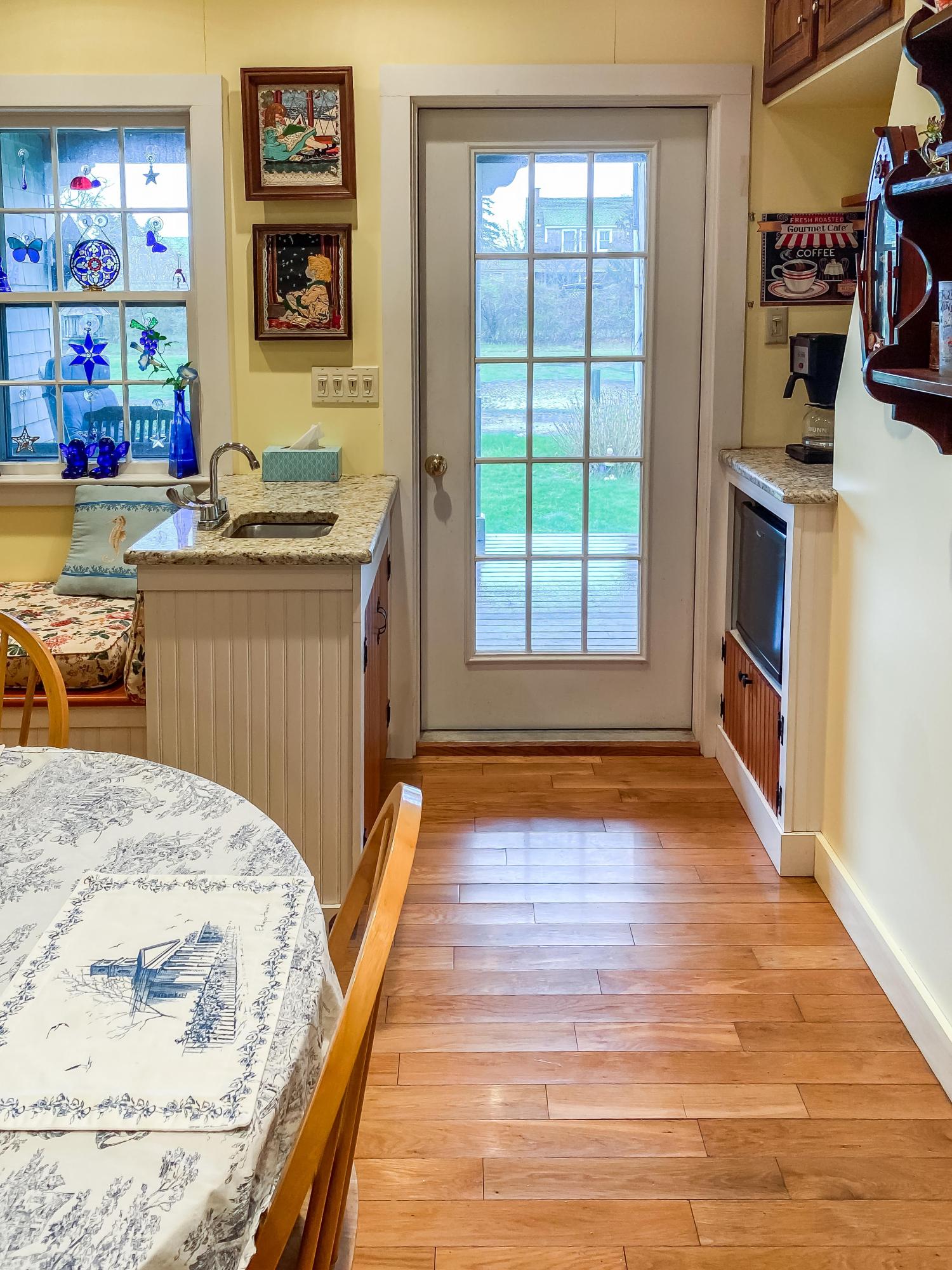 166 Katama Road Edgartown, MA 02539 - Photo 16 of 42 a bedroom with a bed and a wooden floor