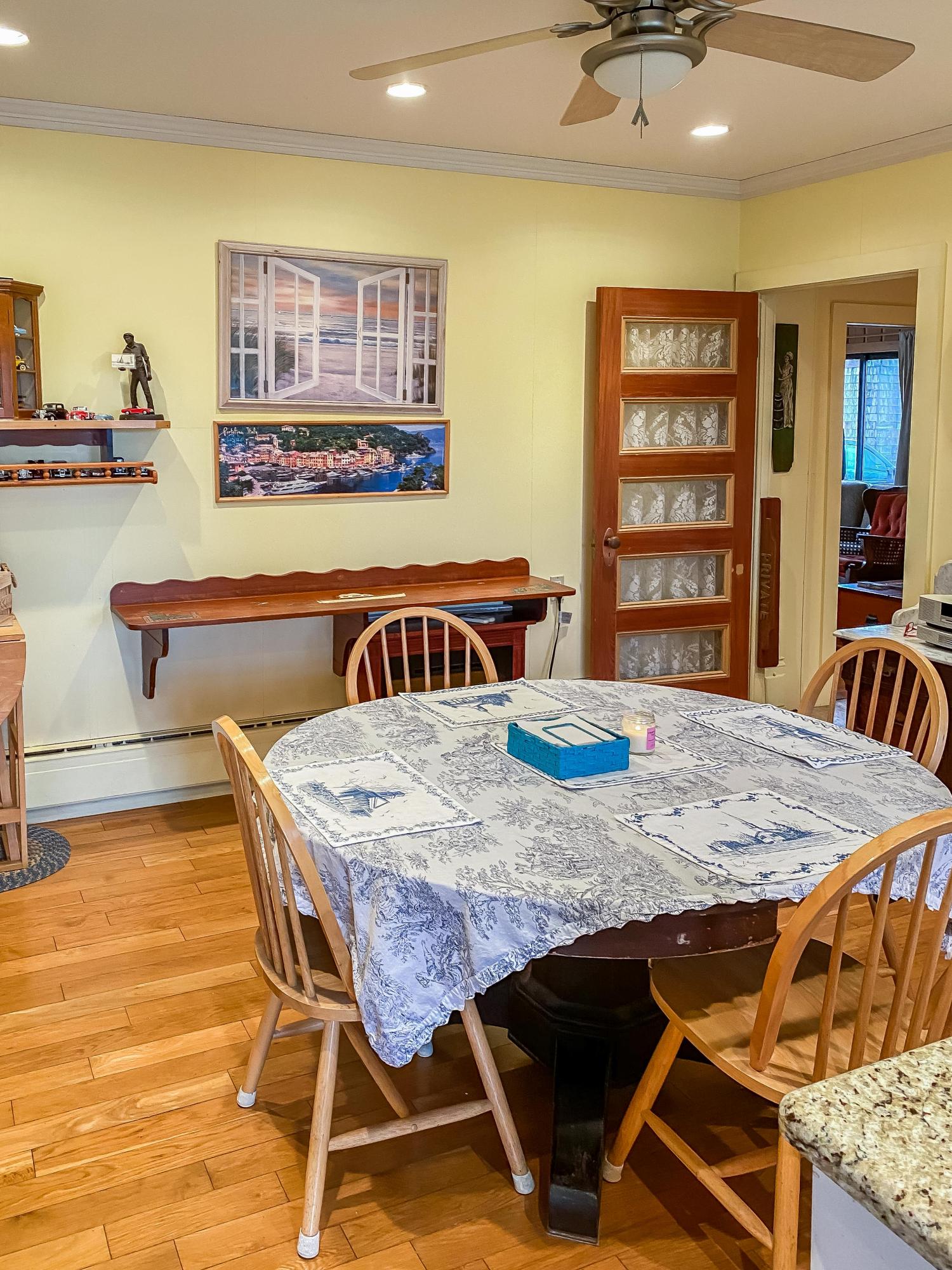 166 Katama Road Edgartown, MA 02539 - Photo 17 of 42 a view of a dining room with furniture and chandelier