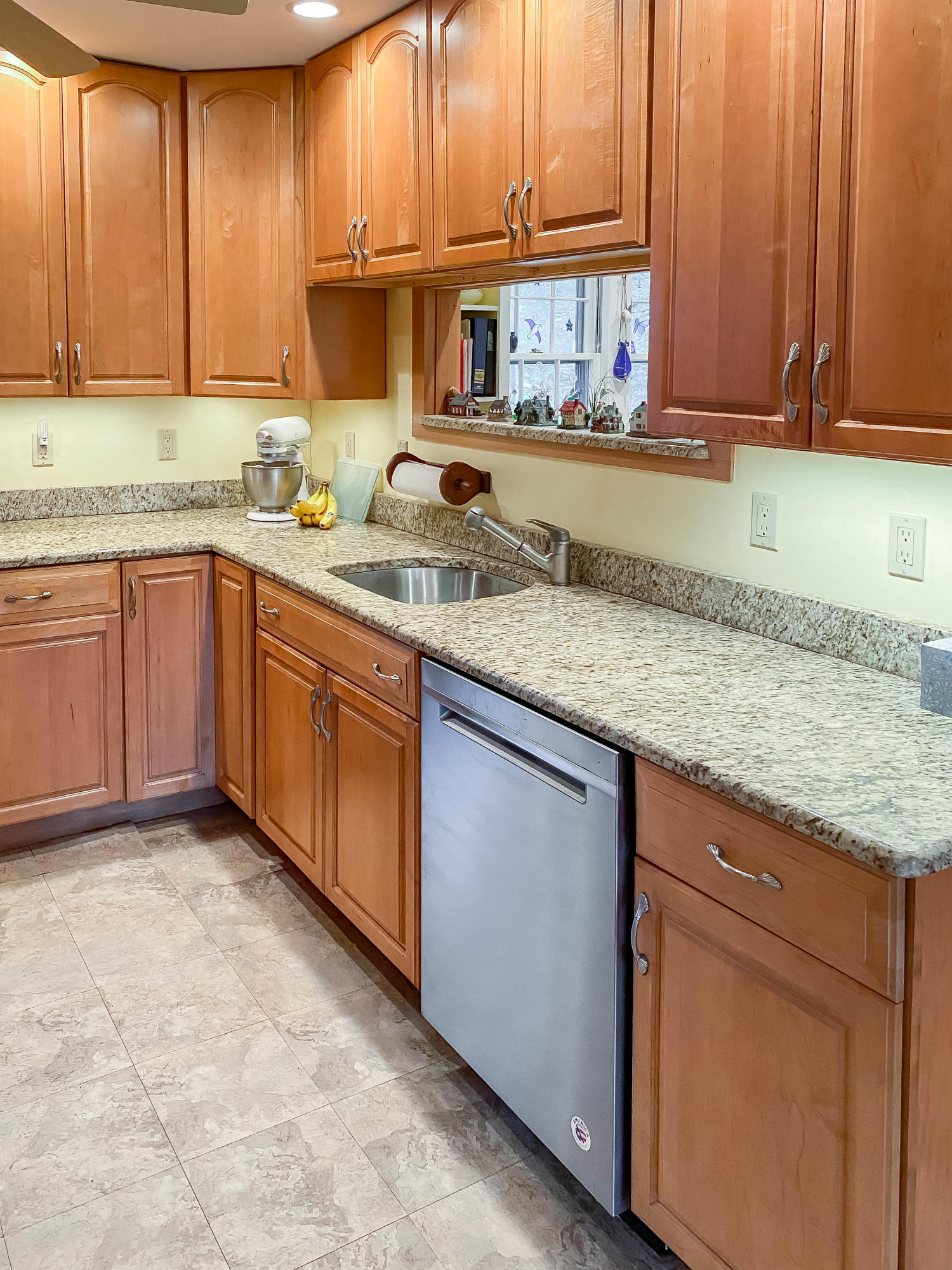 166 Katama Road Edgartown, MA 02539 - Photo 19 of 42 a kitchen with granite countertop a sink window and cabinets