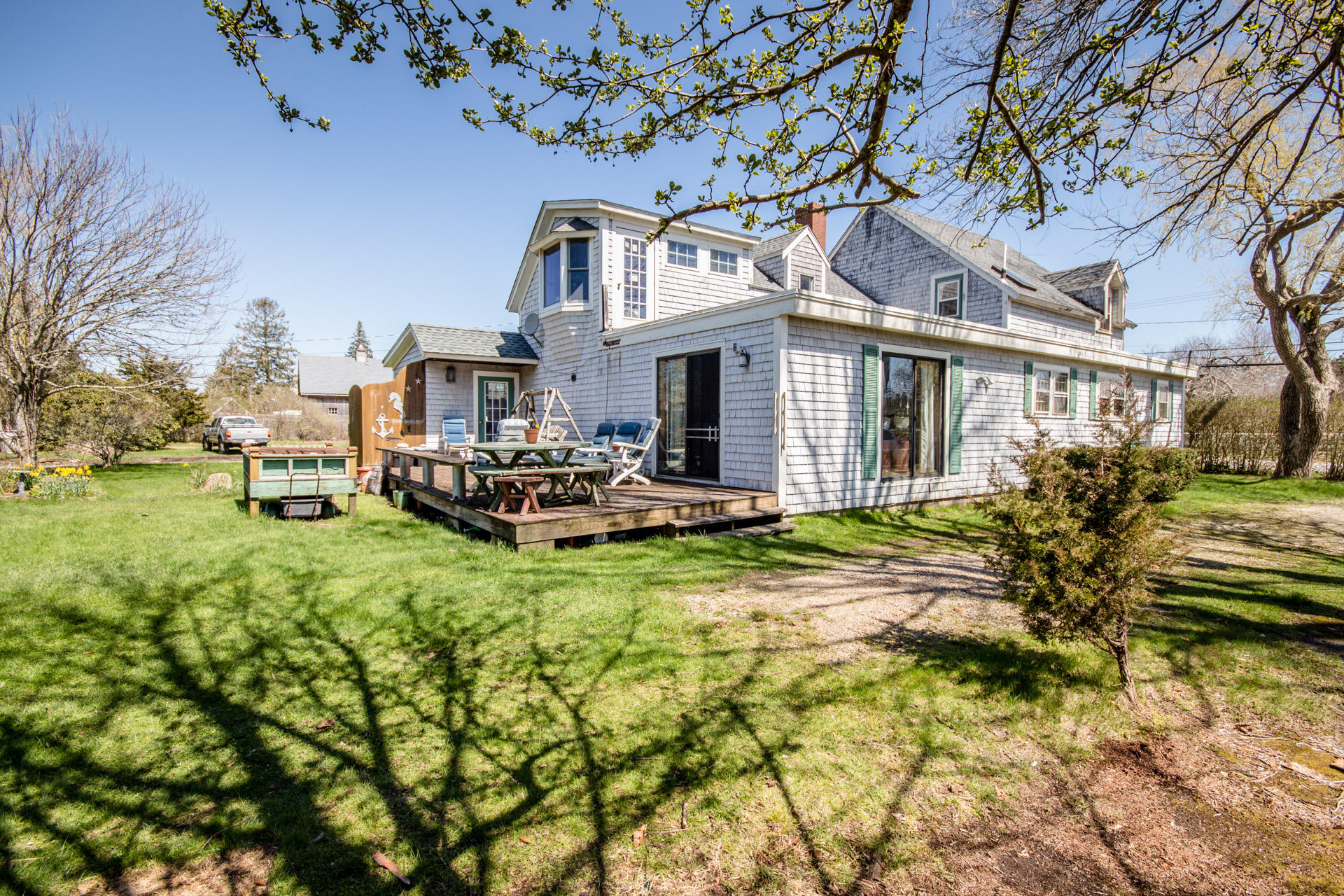 166 Katama Road Edgartown, MA 02539 - Photo 2 of 42 a view of a house with a big yard plants and large trees
