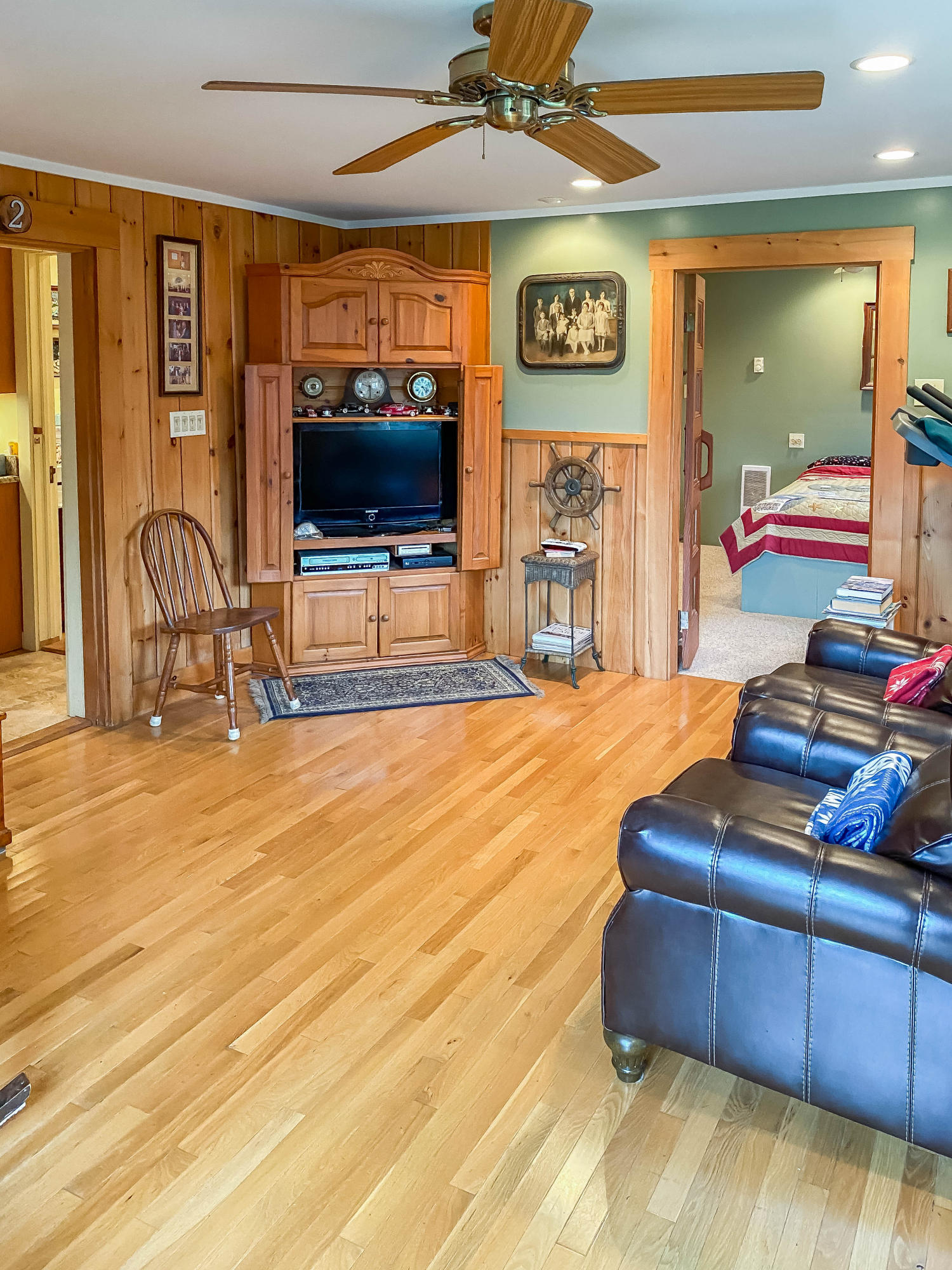 166 Katama Road Edgartown, MA 02539 - Photo 25 of 42 a living room with furniture and a flat screen tv