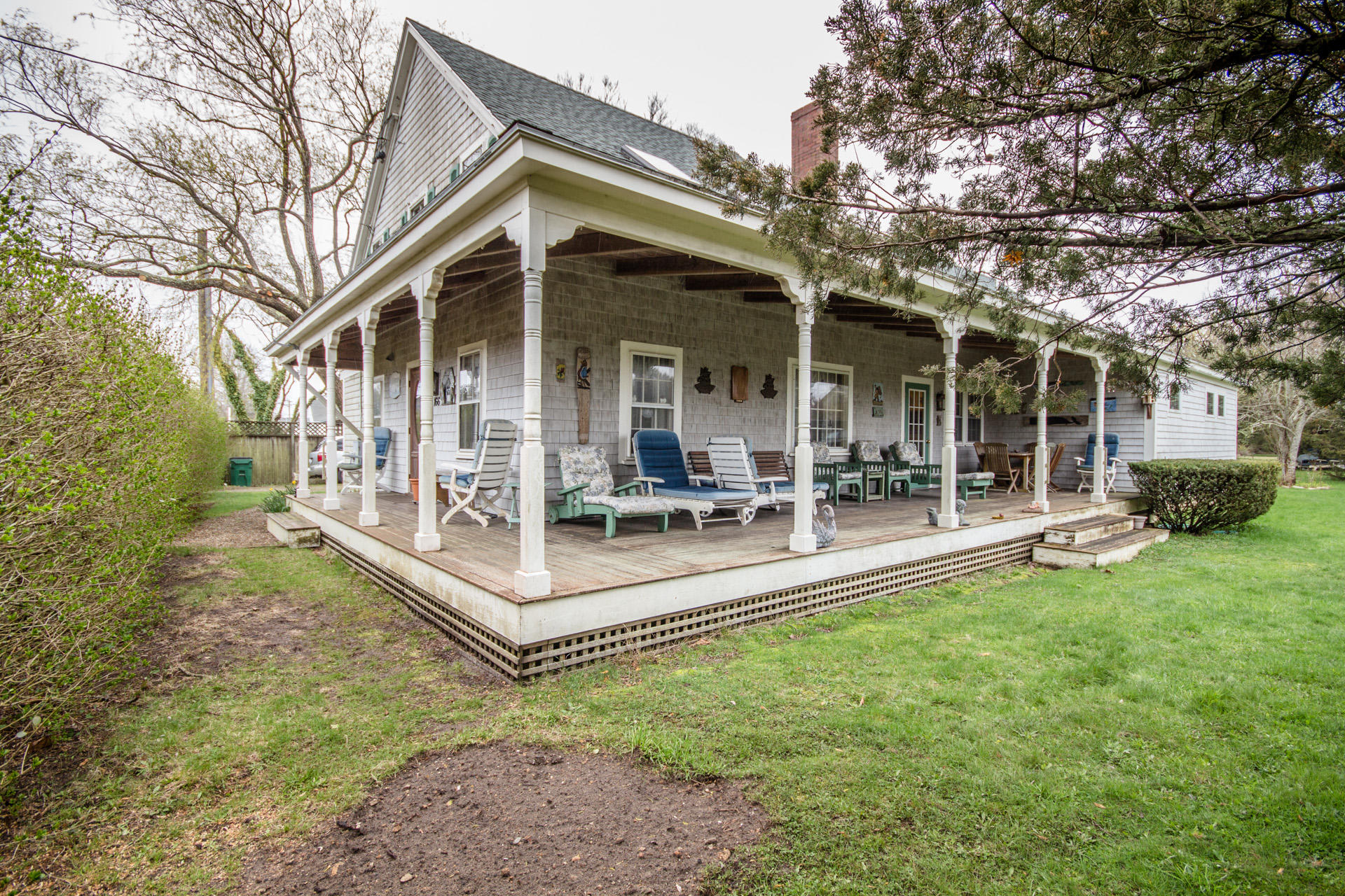 166 Katama Road Edgartown, MA 02539 - Photo 3 of 42 a view of a house with backyard porch and sitting area