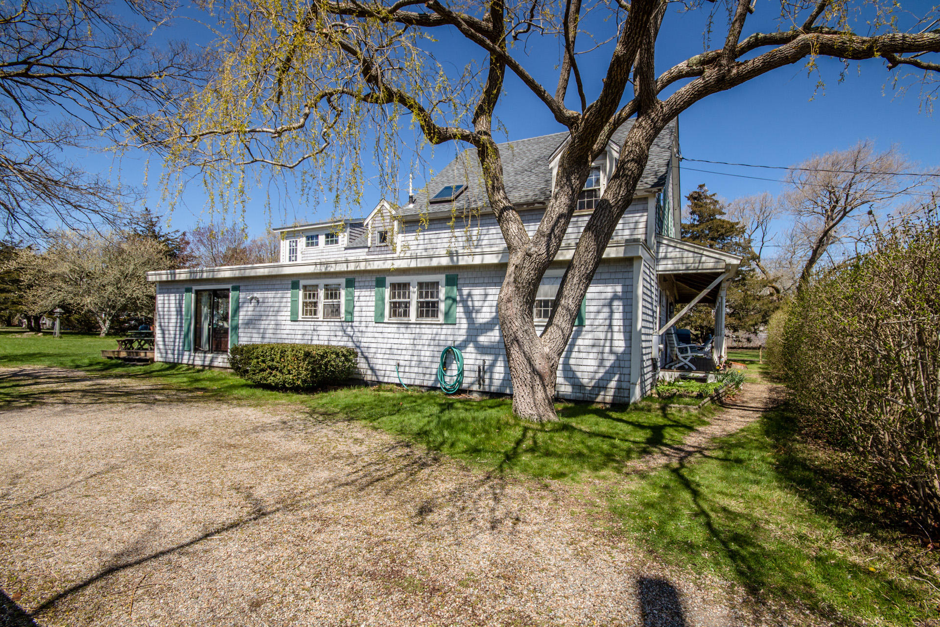 166 Katama Road Edgartown, MA 02539 - Photo 4 of 42 a view of a house with a yard