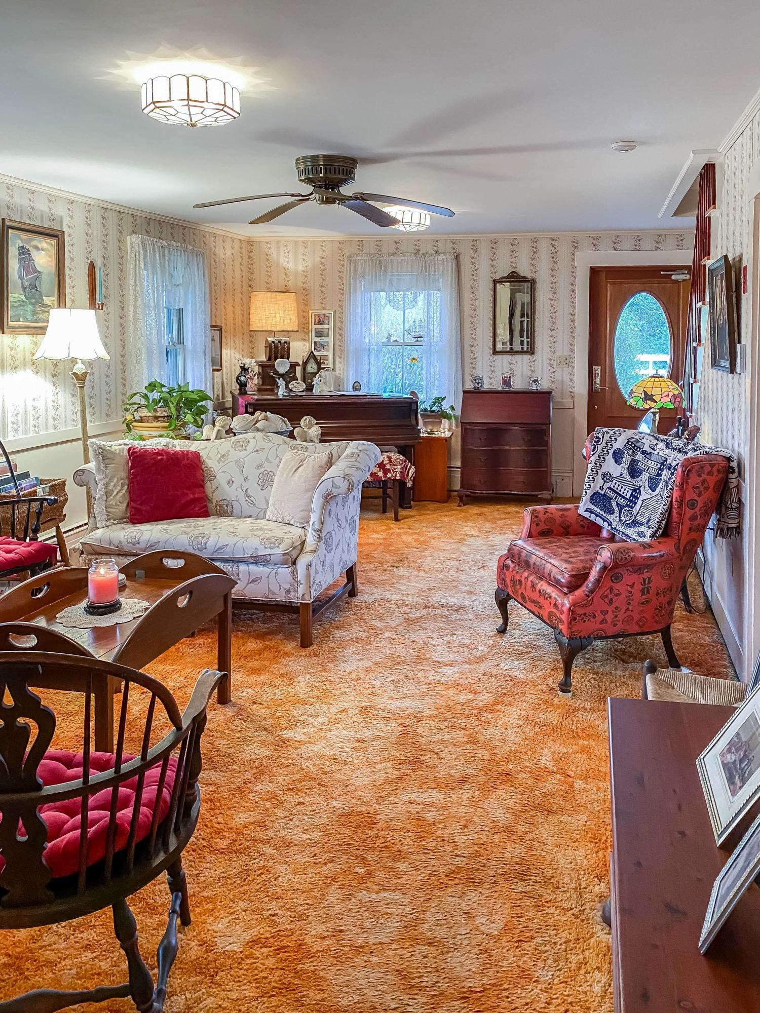 166 Katama Road Edgartown, MA 02539 - Photo 9 of 42 a living room with furniture and a wooden floor