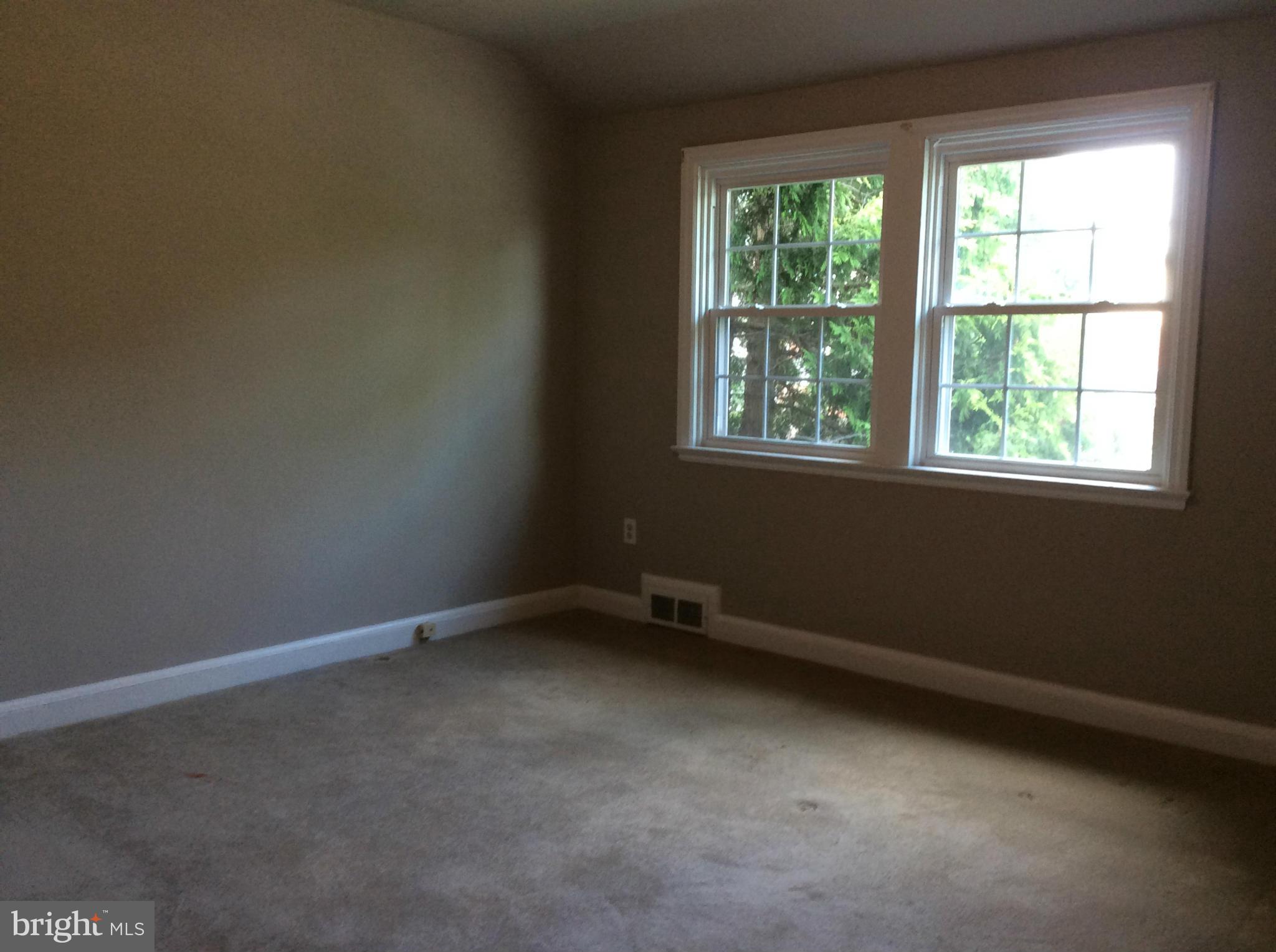1423 Stonewood Road Baltimore, MD 21239 - Photo 14 of 29 an empty room with a window
