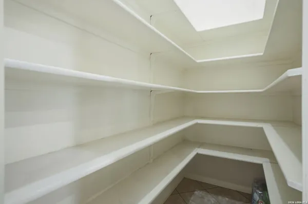 a view of an empty walk in closet