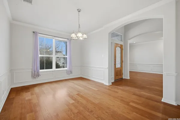 a view of livingroom with window wooden floor and front door
