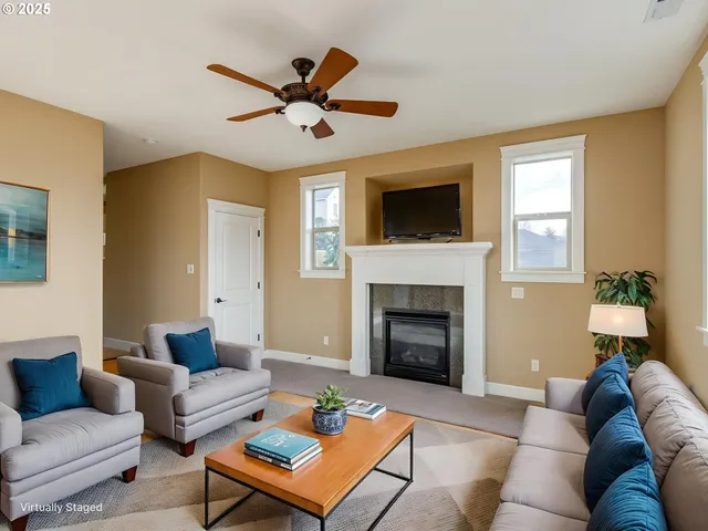 a view of a room with wooden floor and windows