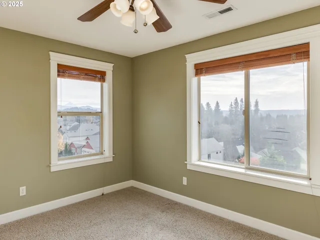 a bedroom with a large bed and a large window