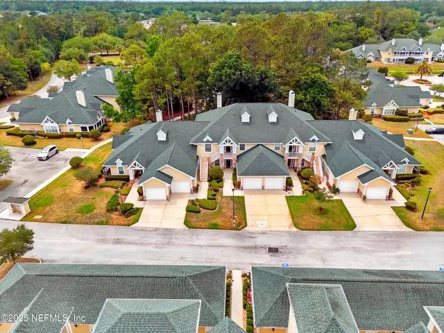 an aerial view of a house with swimming pool