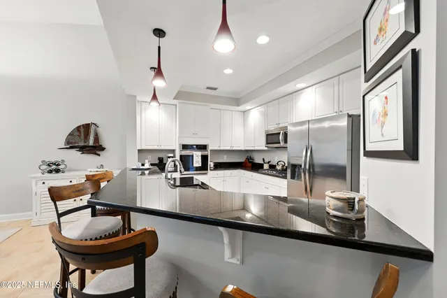 an aerial view of residential house with outdoor space and swimming pool