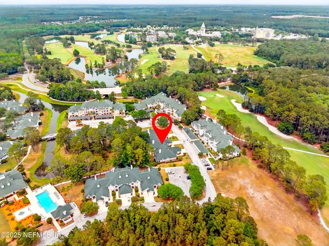 a view of a kitchen with furniture and a window