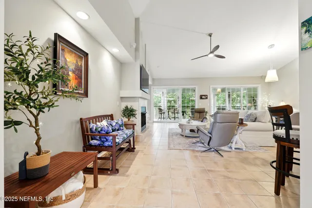 a kitchen with stainless steel appliances granite countertop white cabinets granite counter tops and a window