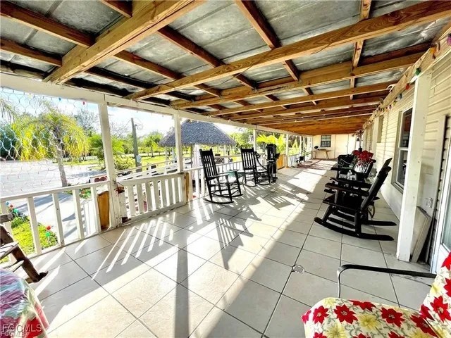 a view of a porch with wooden floor