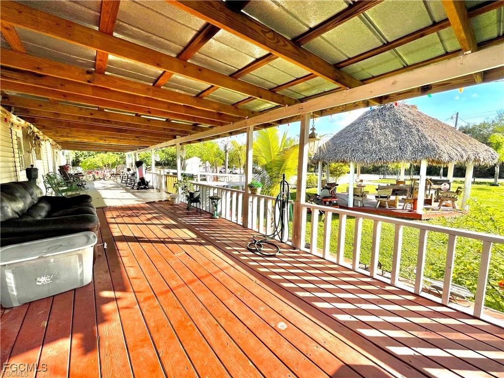 270 G Road LaBelle, FL 33935 - Photo 7 of 14 a view of a porch with wooden floor