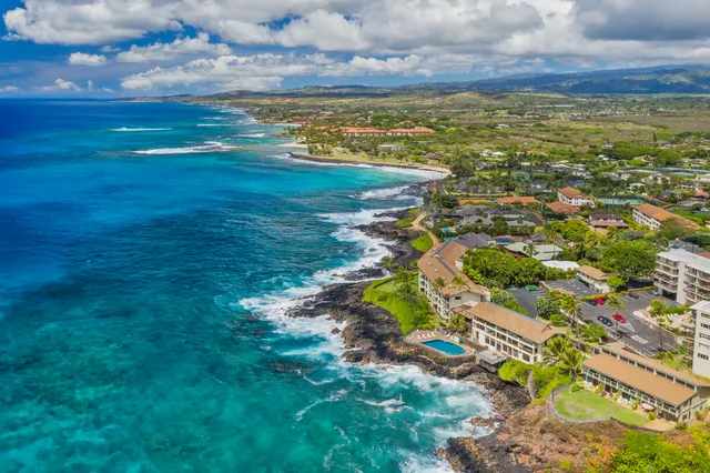 a kitchen with a sink and a stove next to a window