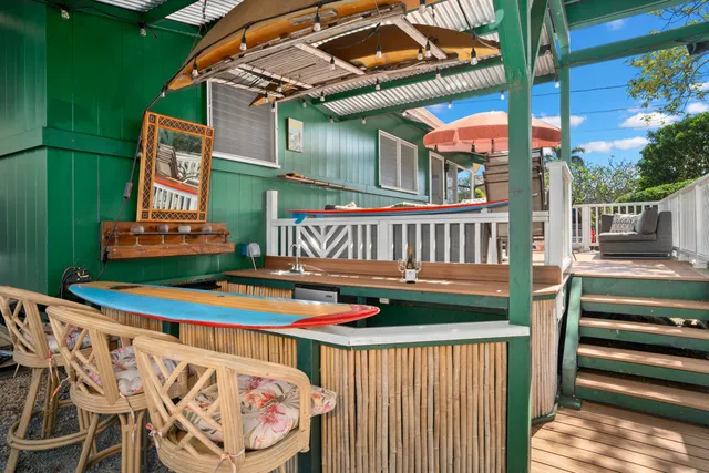 a spacious bedroom with a bed and a flat screen tv